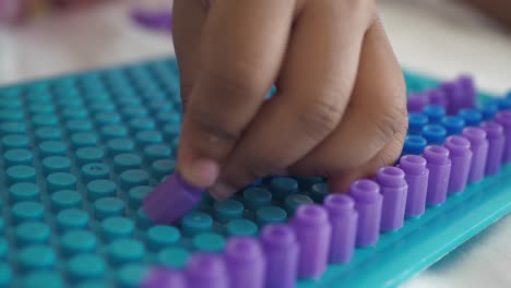 purple and blue peg board art project