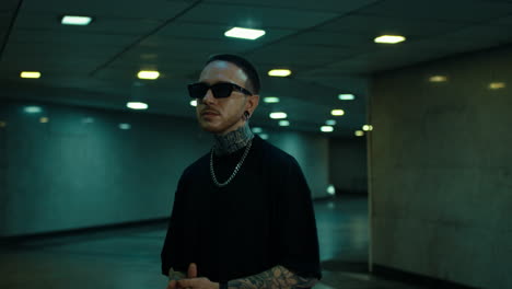 stylish man in underground tunnel