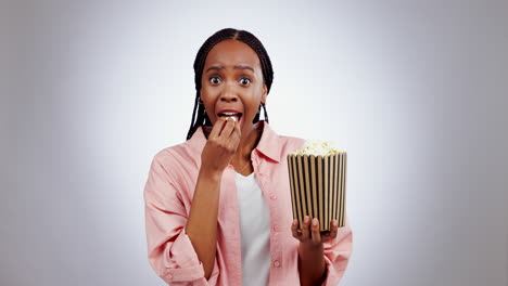 Woman,-popcorn-and-laughing-portrait-in-studio