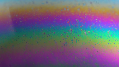 rotating abstract multicolor soap bubble texture. macro. slow motion. planet in science fiction universe.