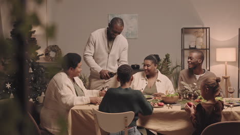 family celebrating christmas dinner