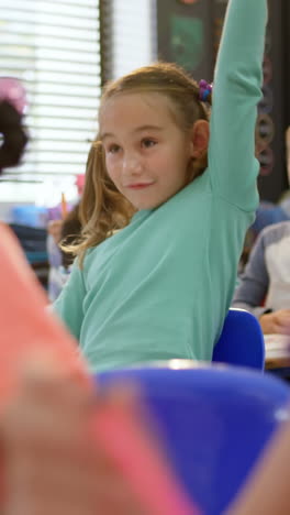 front view of caucasian schoolgirl studying in the classroom 4k