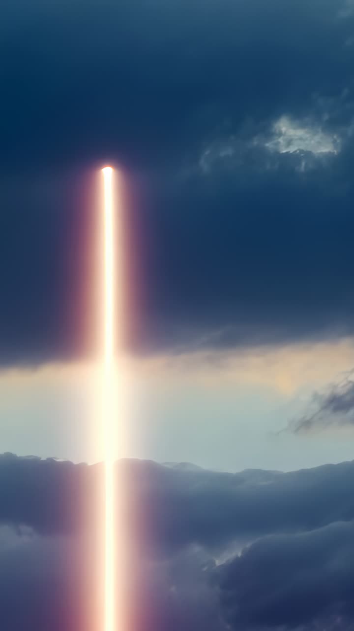 Vertical video: Elongating small dot into beam cutting through clouds in sky, creating impact glow