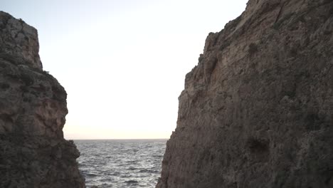 very steep and rocky hills in malta coastline during winter near mediterranean sea