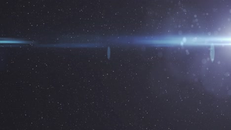 animation of light trails and spots on black background