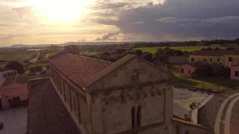 picturesque aerial view of old tratalias church facade, golden hour, forward