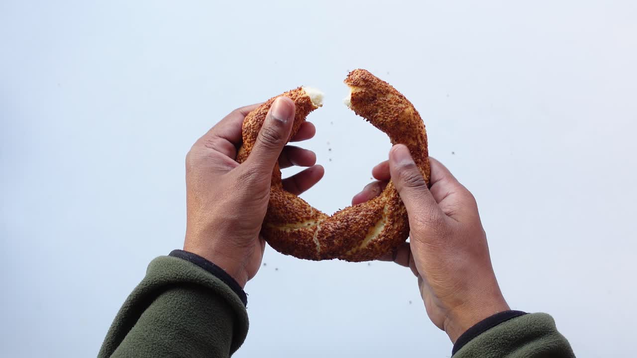 Hands holding Turkish Simit