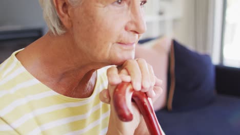 Video-of-thoughtful-caucasian-senior-woman-with-walking-stick