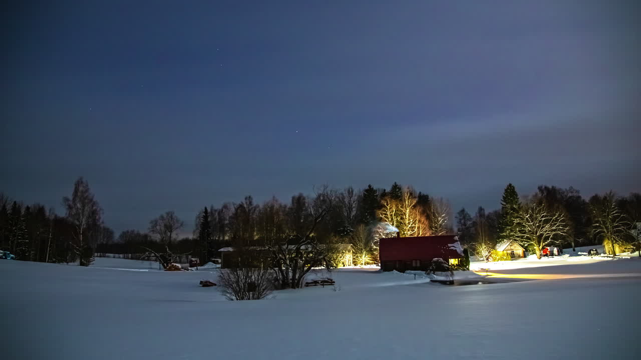 paisaje invernal con casas donde la luz se enciende y apaga durante un período de tiempo