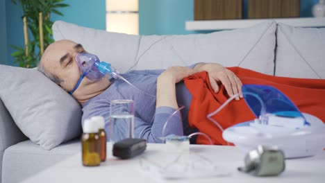 lung patient man coughing and wearing respirator.