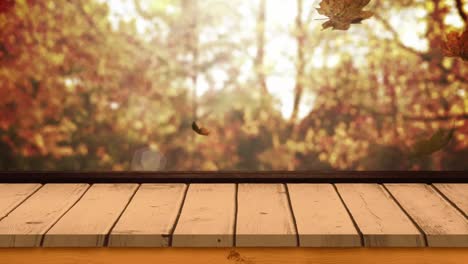 tabla de madera contra las hojas de otoño 4k