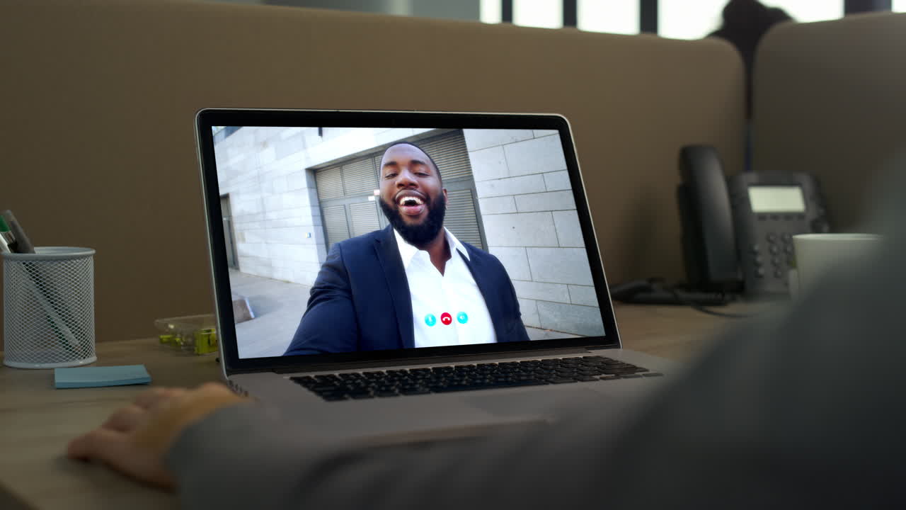 Consultant meeting video call with smiling client close up. Videoconference