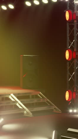 empty concert stage with speaker and red lights