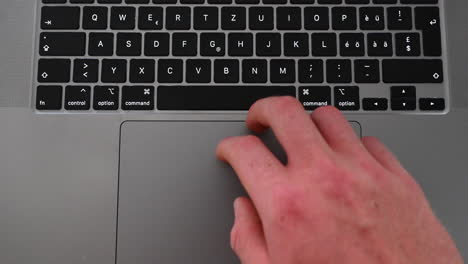 a laptop user is typing on letters to write a text, online message on a computer