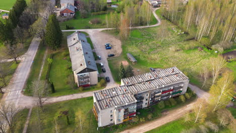 aerial view of residential blockhouse from post-soviet times surrounded by nature