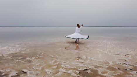 sunset and whirling at the sea, sufi. sufi whirling (turkish: semazen)