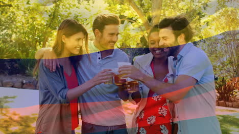 Toasting-drinks-outdoors-with-friends,-animated-flag-colors-in-background