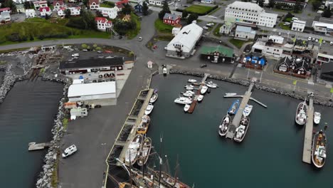 aerial of boats in the harbour of húsavík, a small town in iceland