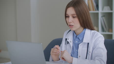 online appointment with experienced female doctor woman is communicating online with patient or colleague