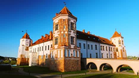 mir, belarus. mir castle complex. architectural ensemble of feudalism, ancient cultural monument, unesco world heritage site. famous landmark in summer sunny morning under blue sky