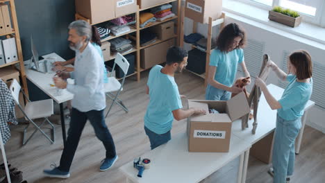 volunteers sorting donations in a charity center