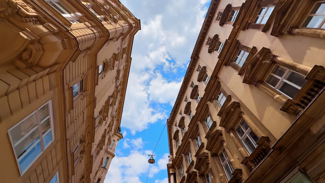 Vienna, Austria - June 9, 2025: Looking up at the beautiful architecture of historical part of the city. Admiring the old buildings of Vienna, Austria