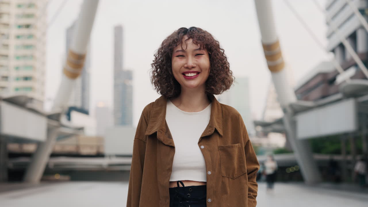 Smiling Woman in Cityscape