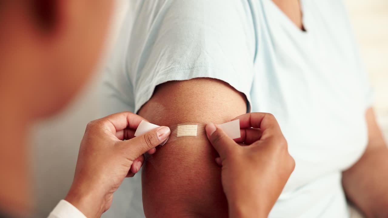 Applying a bandage to an arm