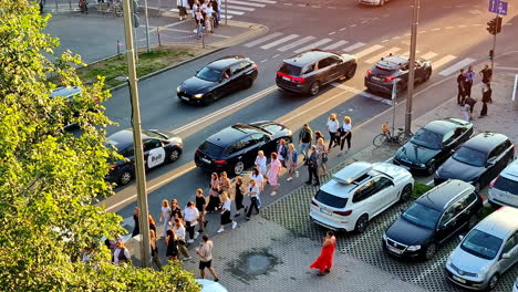 tourists walk in busy streets of greece during summer, aerial view