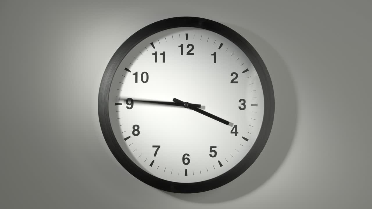 Clock Face in Time Lapse on White Wall in Office