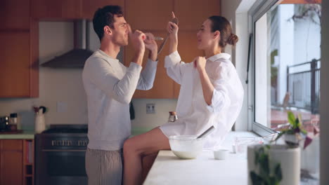 Singing,-love-or-happy-couple-in-house-kitchen