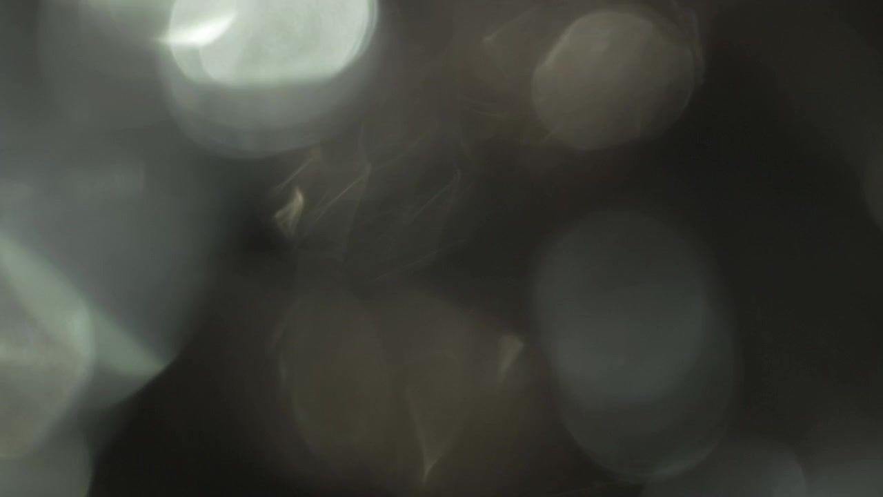 Abstract Light Leaks and Bokeh Overlay on Black Background