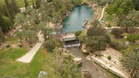 aerial view of a natural spring park with swimming pool and waterfall