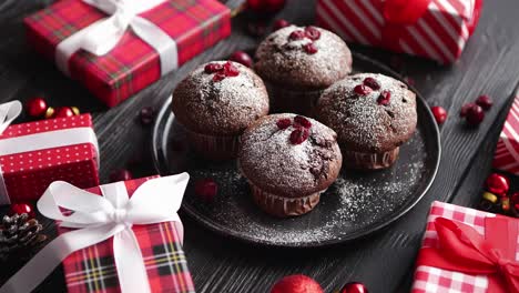 christmas chocolate delicious muffins served on black ceramic plate