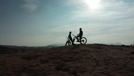 two unrecognizable athletic men taking a break