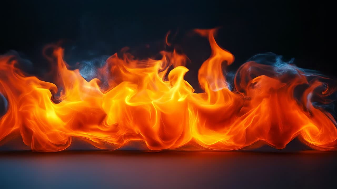 Bright flames in dark space. Flames rise and dance in a dark area, creating light and showcasing vivid colors