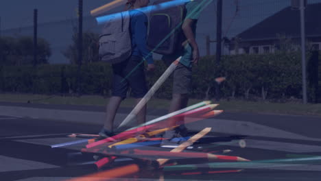 composite video of colored pencils falling against school kids running while crossing the street