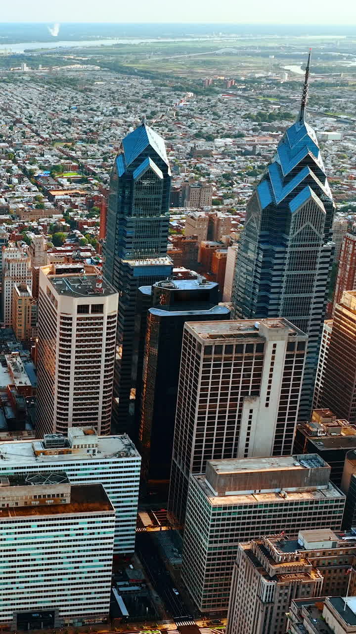 Eye-catching scenery of a big city from top. Beautiful daytime panorama of Philadelphia, USA. Vertical video