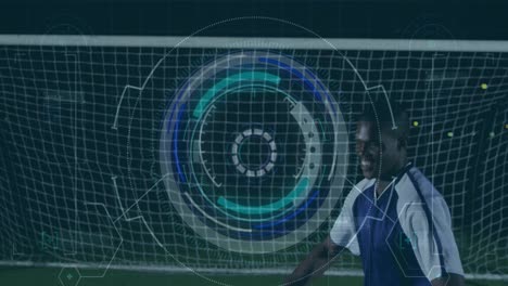 Animation-of-scope-scanning-and-data-processing-over-biracial-football-player-on-pitch