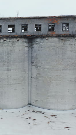 abandoned old building ruins with broken windows. old industrial edifice for demolition. aerial view