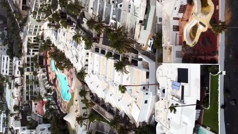 vertical drone shot luxury apartments and holiday resorts in lanzarote