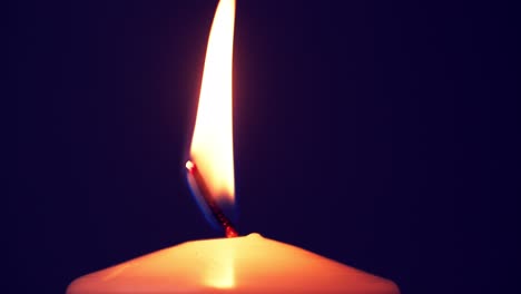 Closeup-of-candle-flame-on-black