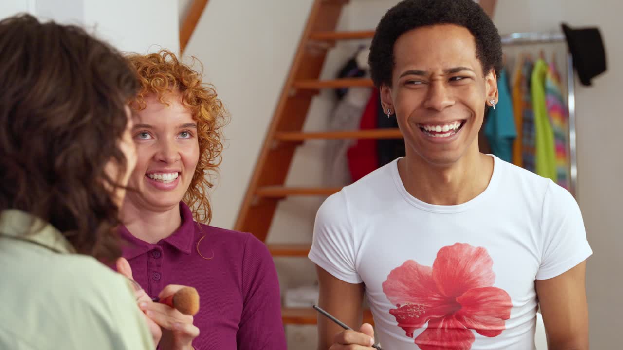 People applying makeup indoors