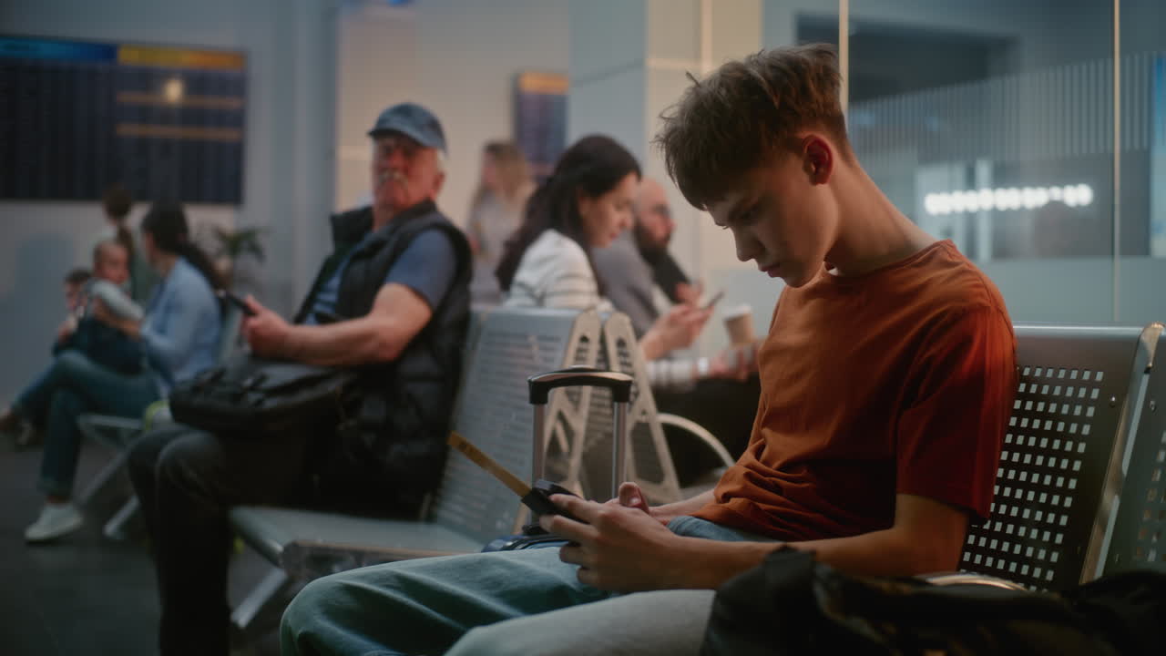 Teenager Waiting at Airport