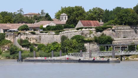 historic buildings along the riverbank in blaye