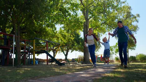 family walking in the playground 4k