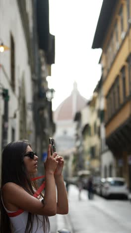 woman taking pictures in florence