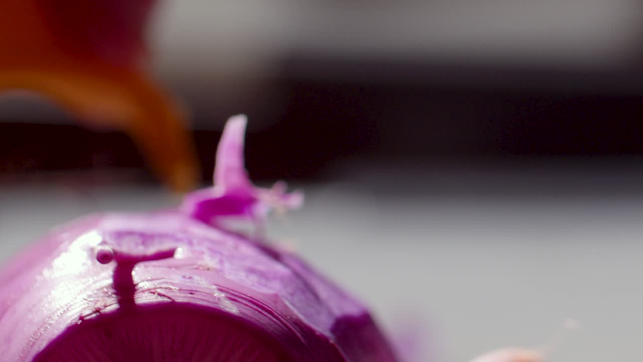 chef peels radish in kitchen