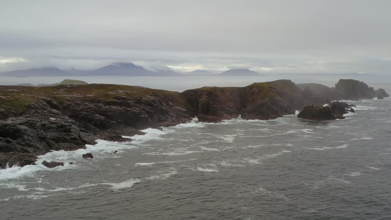 Aerial drone footage of Malin Head’s Hell’s Hole Rock Formations on a Foggy Morning