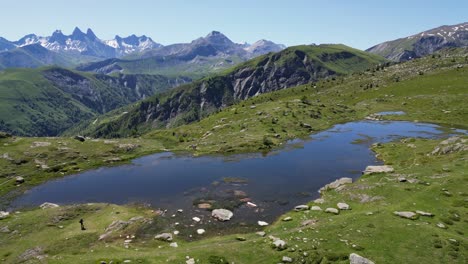 mountain lake lac guichard at french alps, isere savoy, france - aerial dolly forward